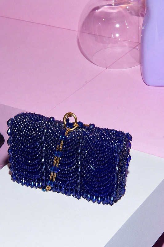 Electric blue clutch bag for wedding guest styling