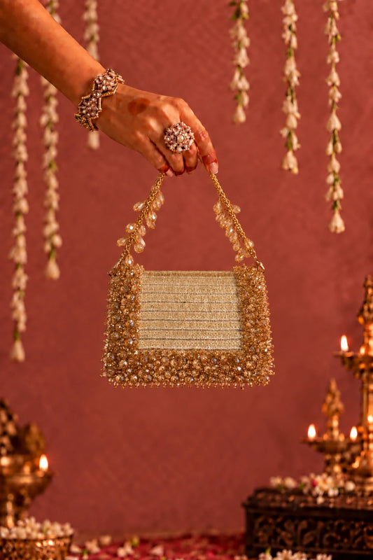 Elegant golden beaded mini handbag for women with handcrafted detailing and a sparkling finish.