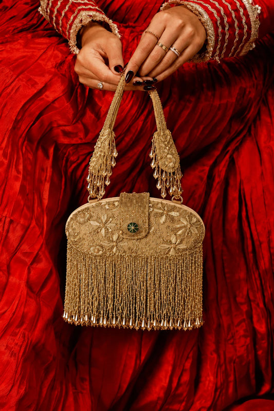 Golden festive clutch bag for wedding functions and celebrations
