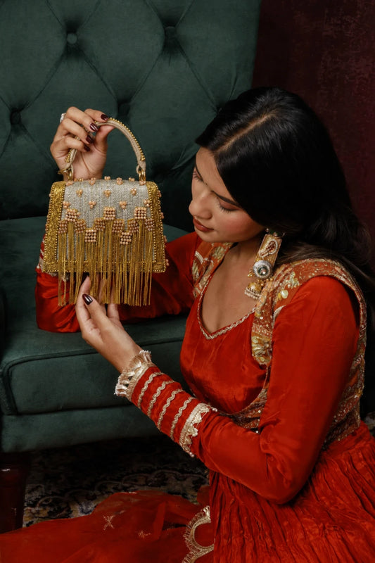 Golden fringe Haldi bag with handcrafted beadwork