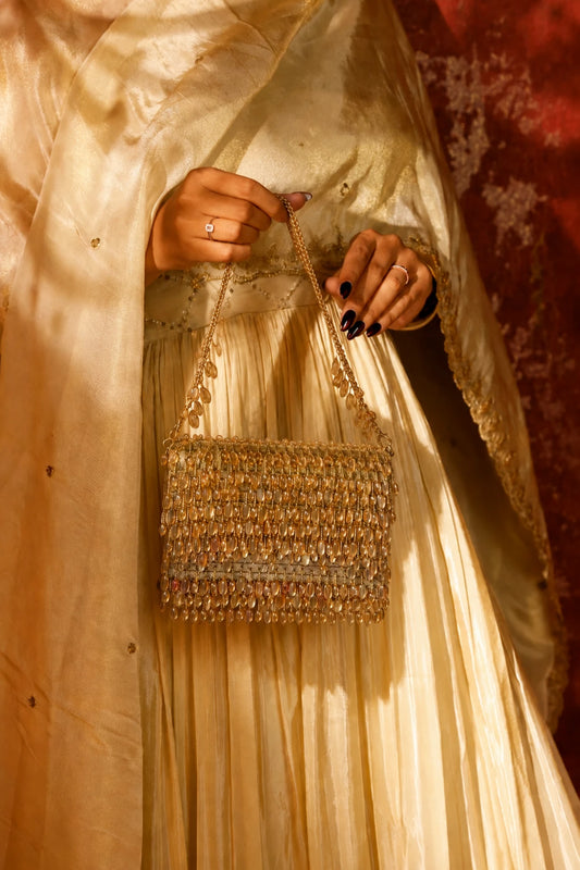 Golden Haldi shoulder bag for women with detailed beadwork