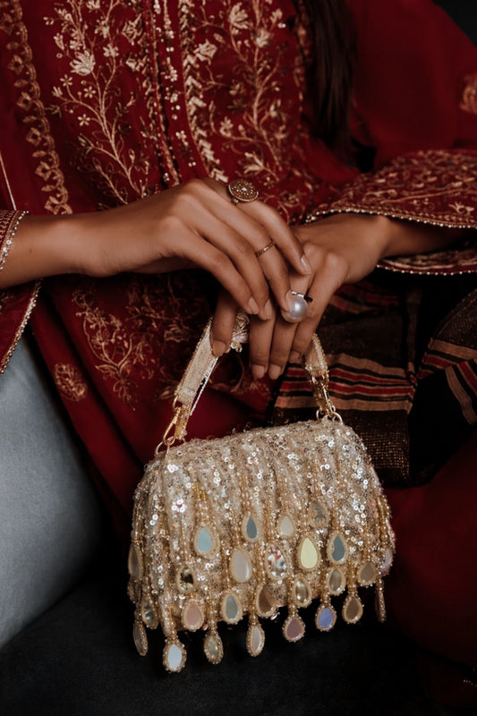 Golden mirror shoulder bag for haldi ceremonies and festive celebrations