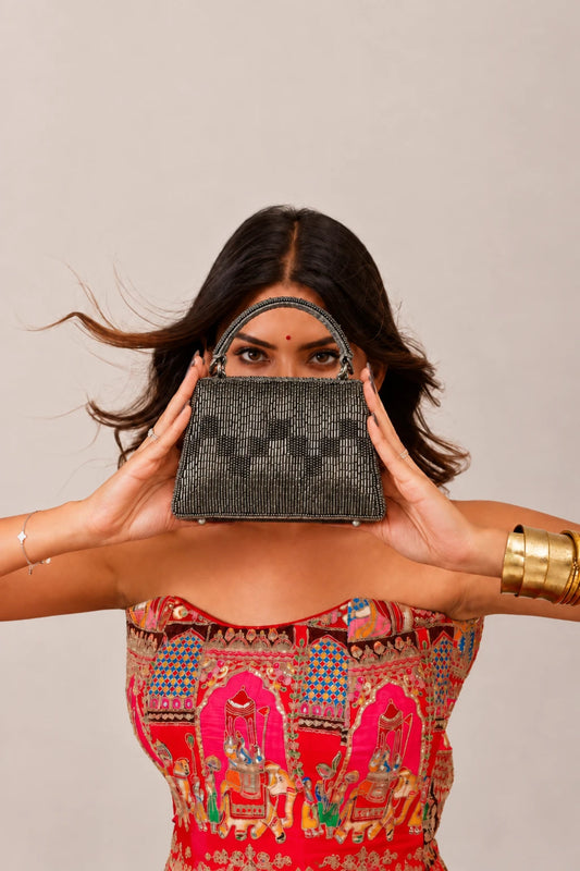 Luxury grey clutch bag with metallic embellishment detailing