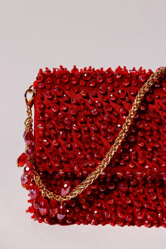 Red festive shoulder bag for women with handcrafted bead detailing