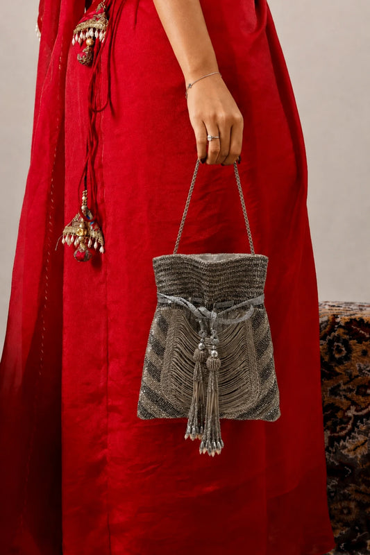 Silver and antique beaded potli bag for festive celebrations