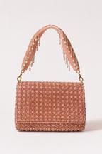 Baby pink everyday handbag with delicate embellishments and elegant pastel styling