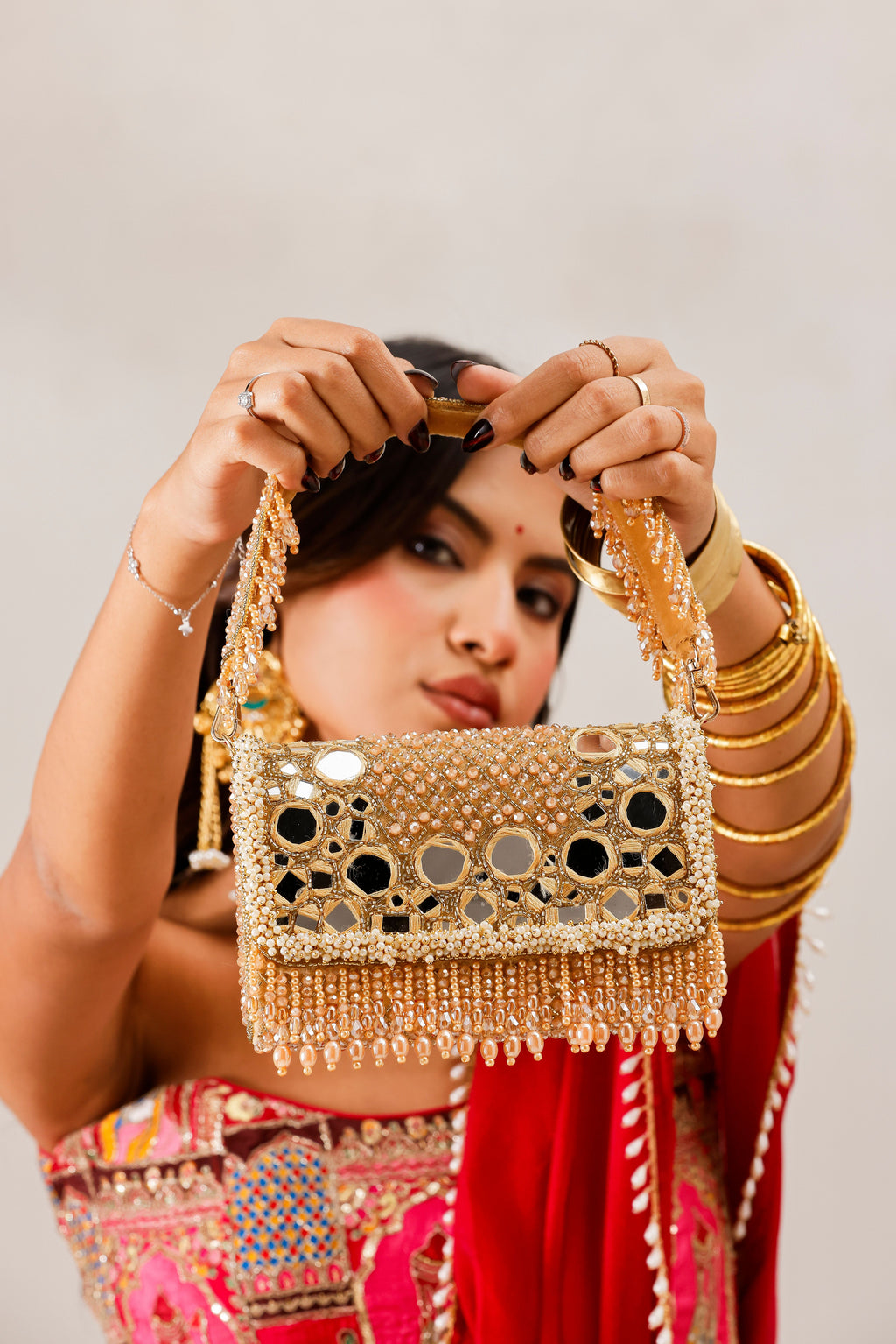 Aaina Golden Bag