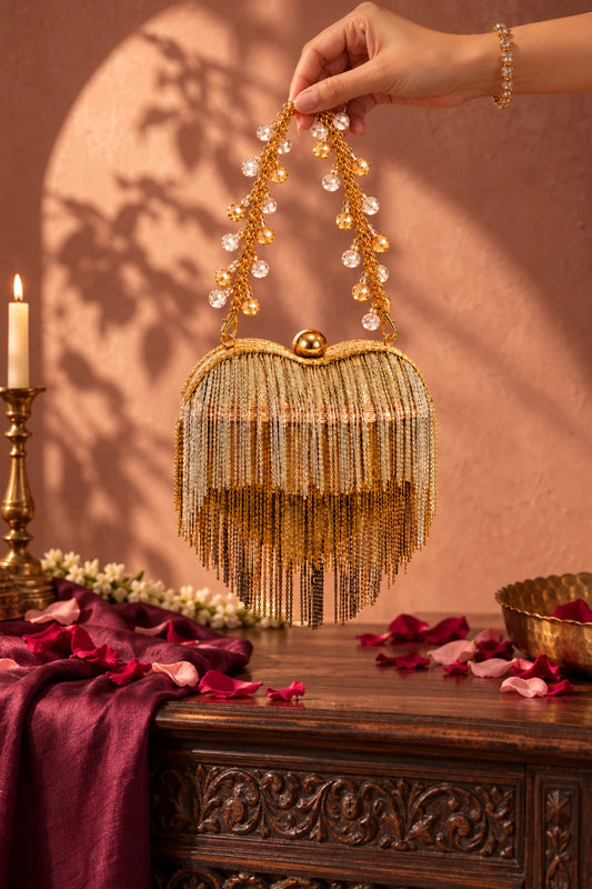 Close-up of Adaa Heart Bag showcasing intricate gold and silver metallic fringe embellishments