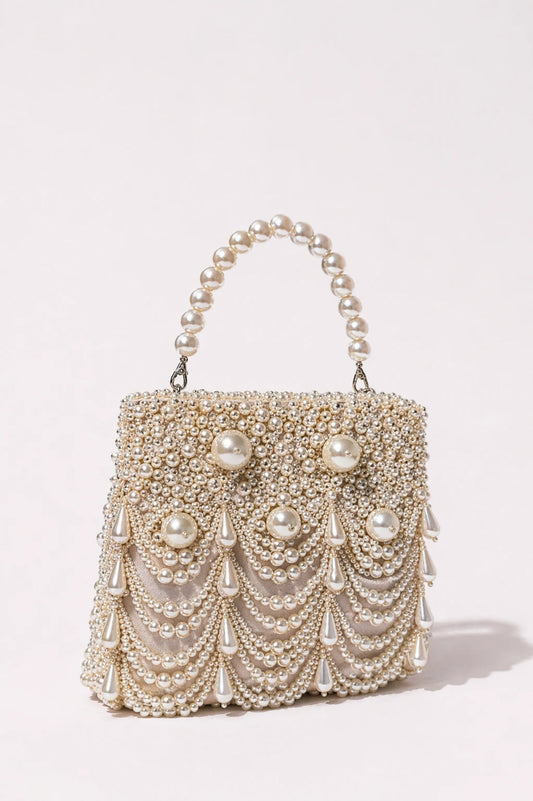 Bridal handbag for wedding occasions with sculpted pearl handle