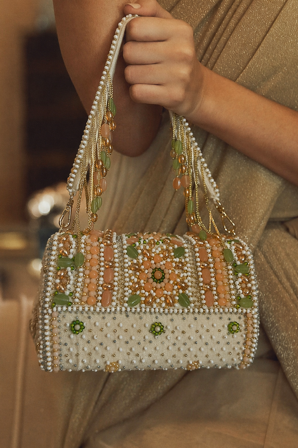 Bridal shoulder bag for haldi function with pearl embellishments and gemstone detailing