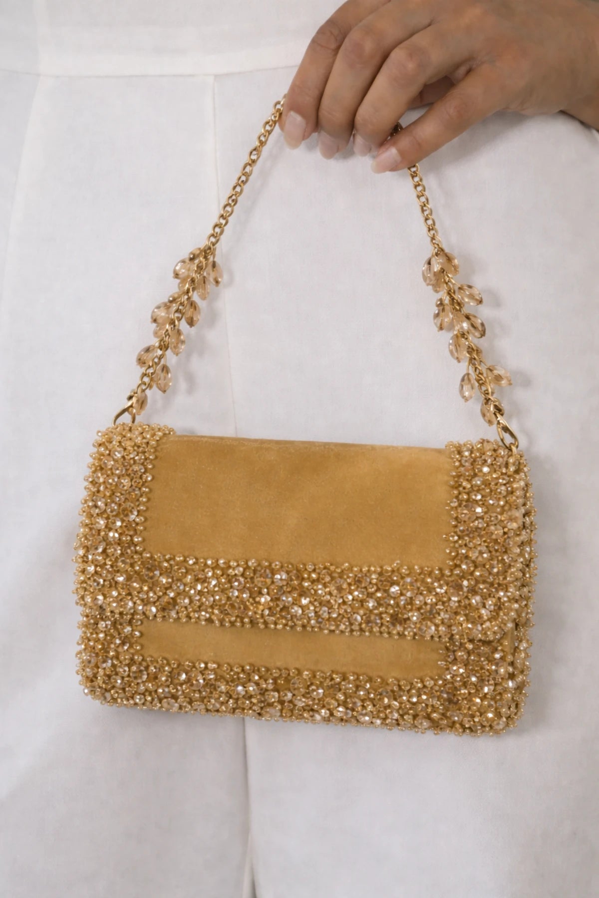 Golden shoulder bag for cocktail parties and evening events