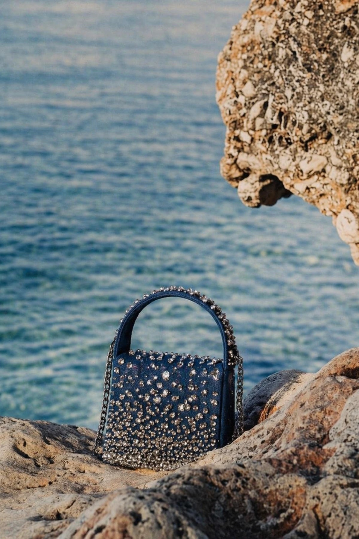 Denim shoulder bag styled with a summer vacation outfit