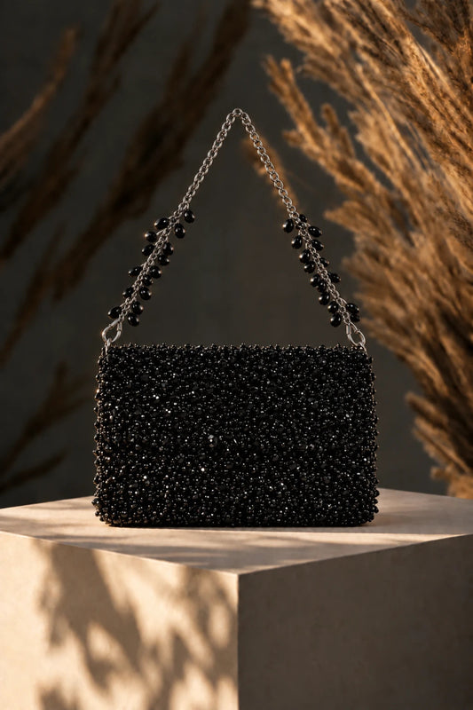 Designer black shoulder bag styled with contemporary western wear