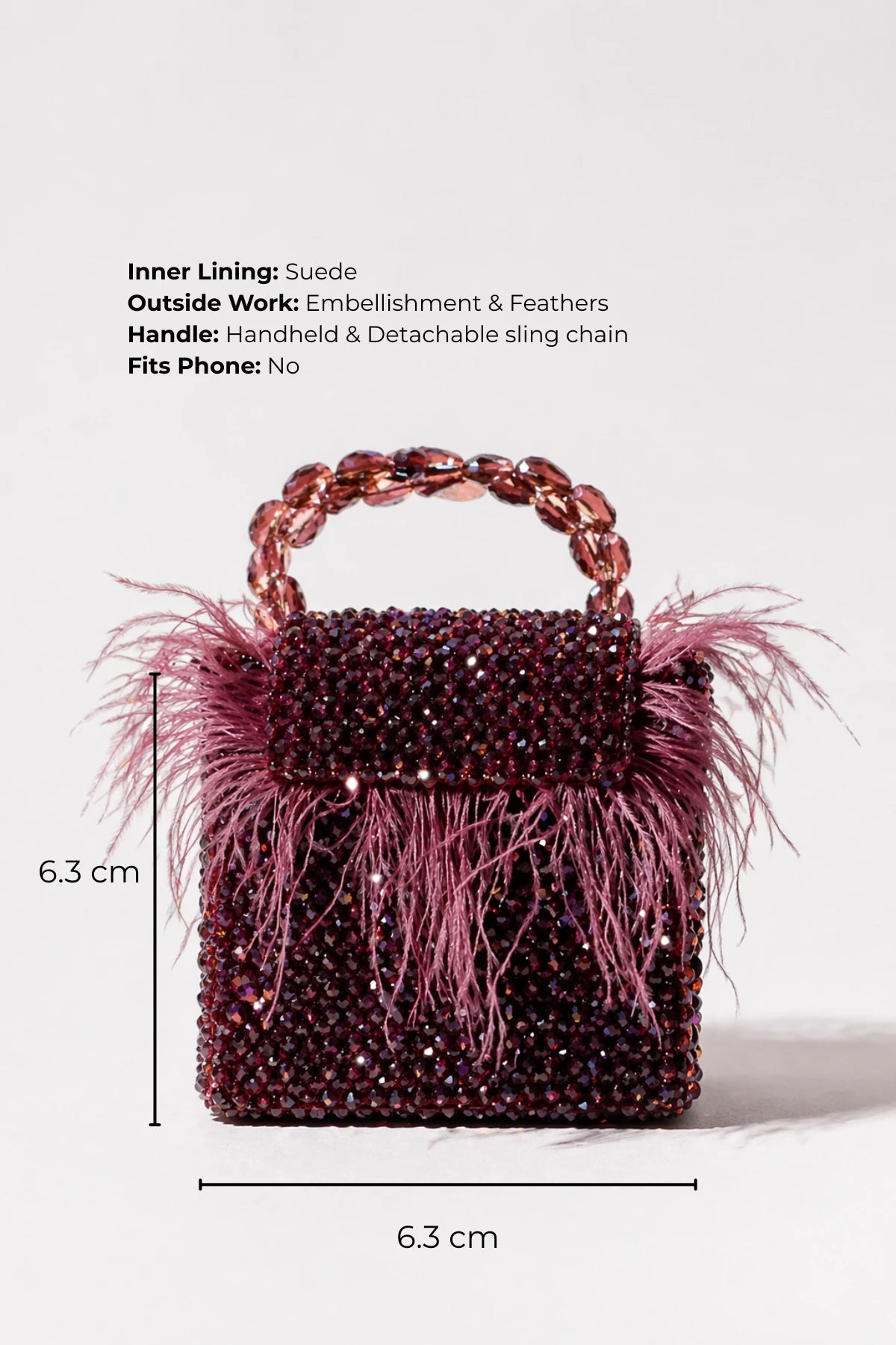 Designer feather mini bag with handcrafted bead detailing
