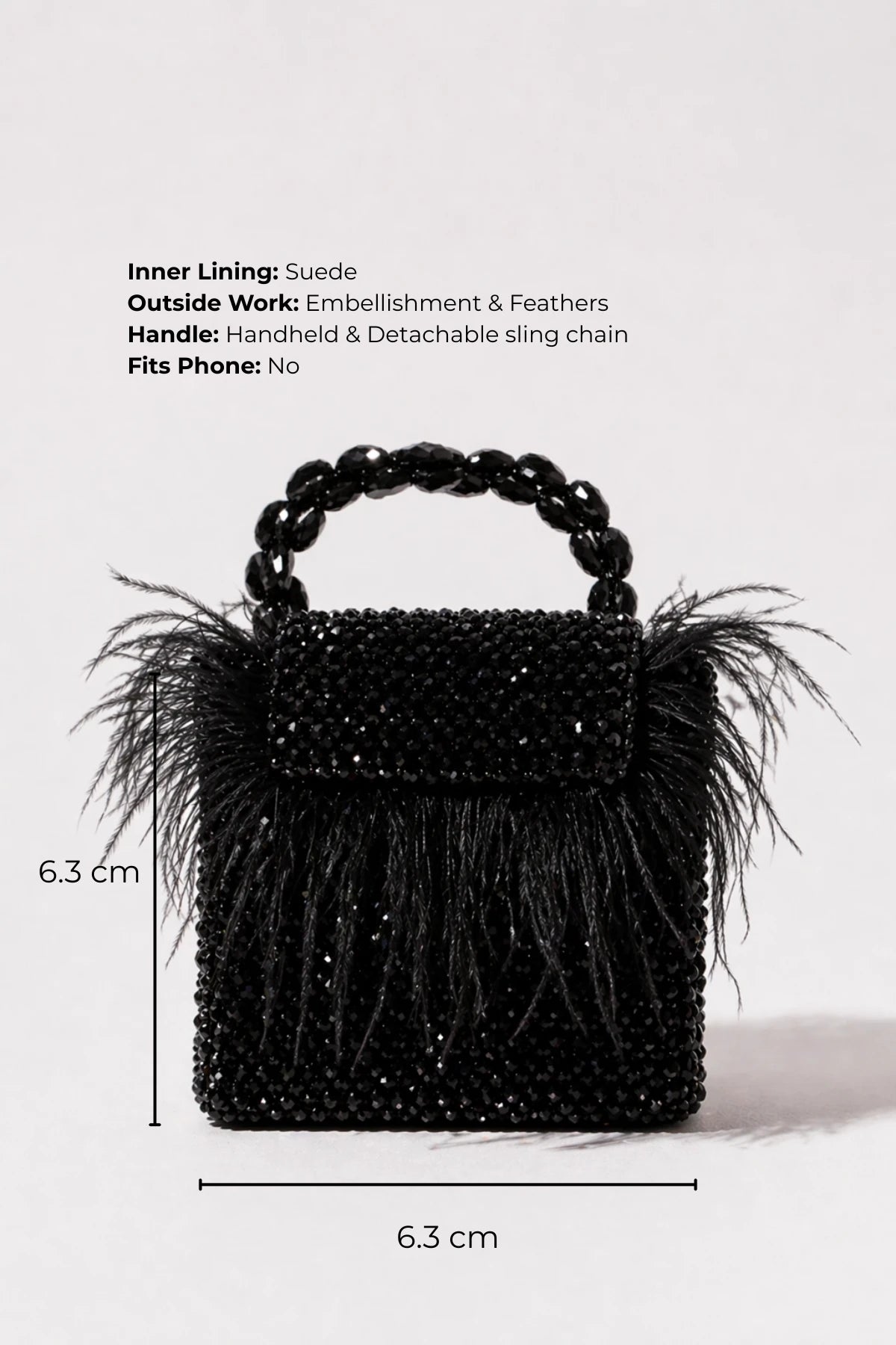 Designer feather mini bag styled with a lehenga for sangeet