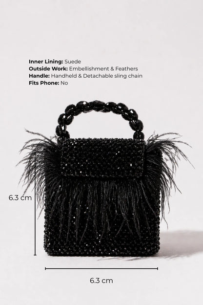 Designer feather mini bag styled with a lehenga for sangeet