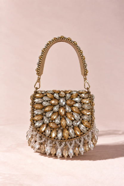 Elegant gold and silver designer mini bag featuring traditional-inspired stonework, perfect for haldi celebrations.