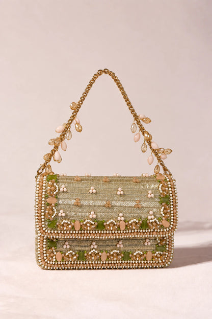 Elegant golden designer handbag with colourful handcrafted embellishments, ideal for Haldi functions and daytime wedding celebrations.