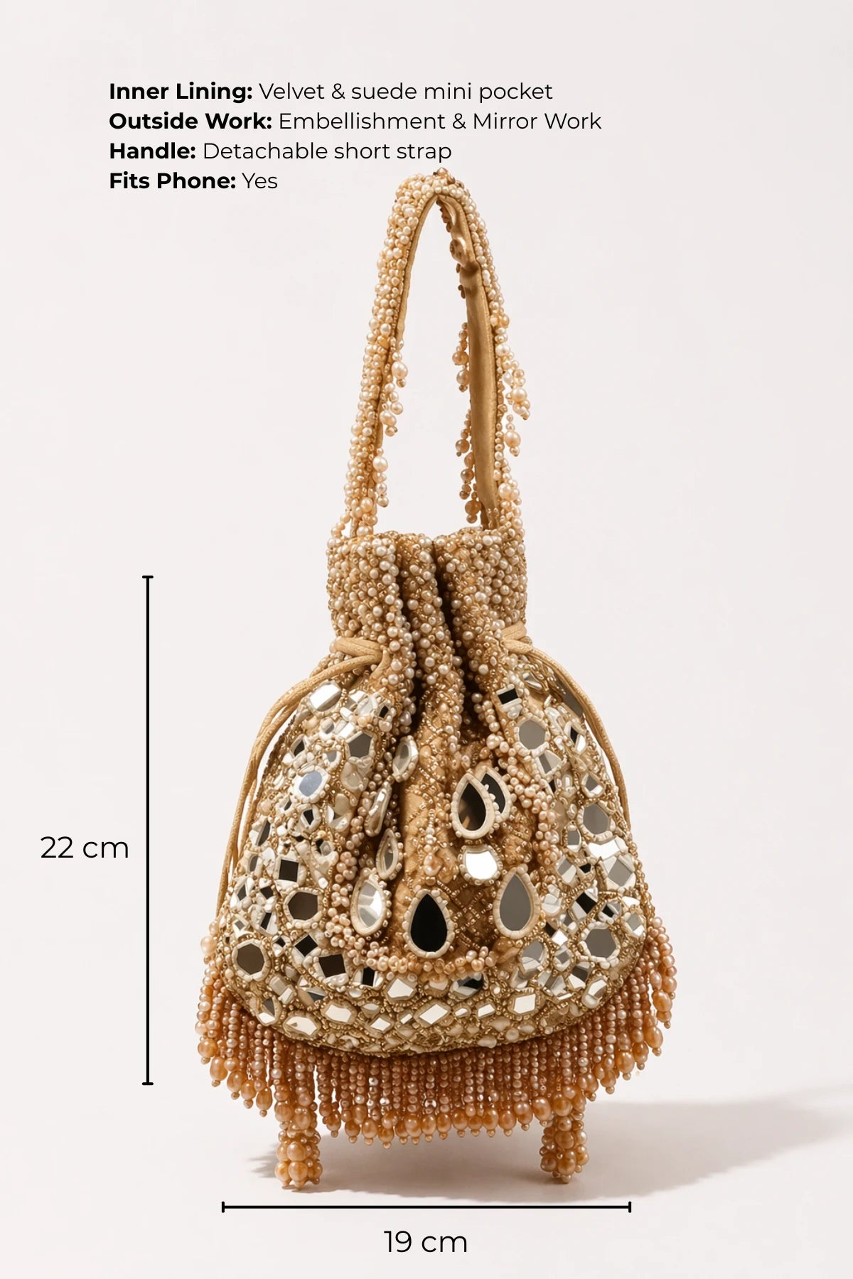 Designer golden potli bag styled with a bridal lehenga