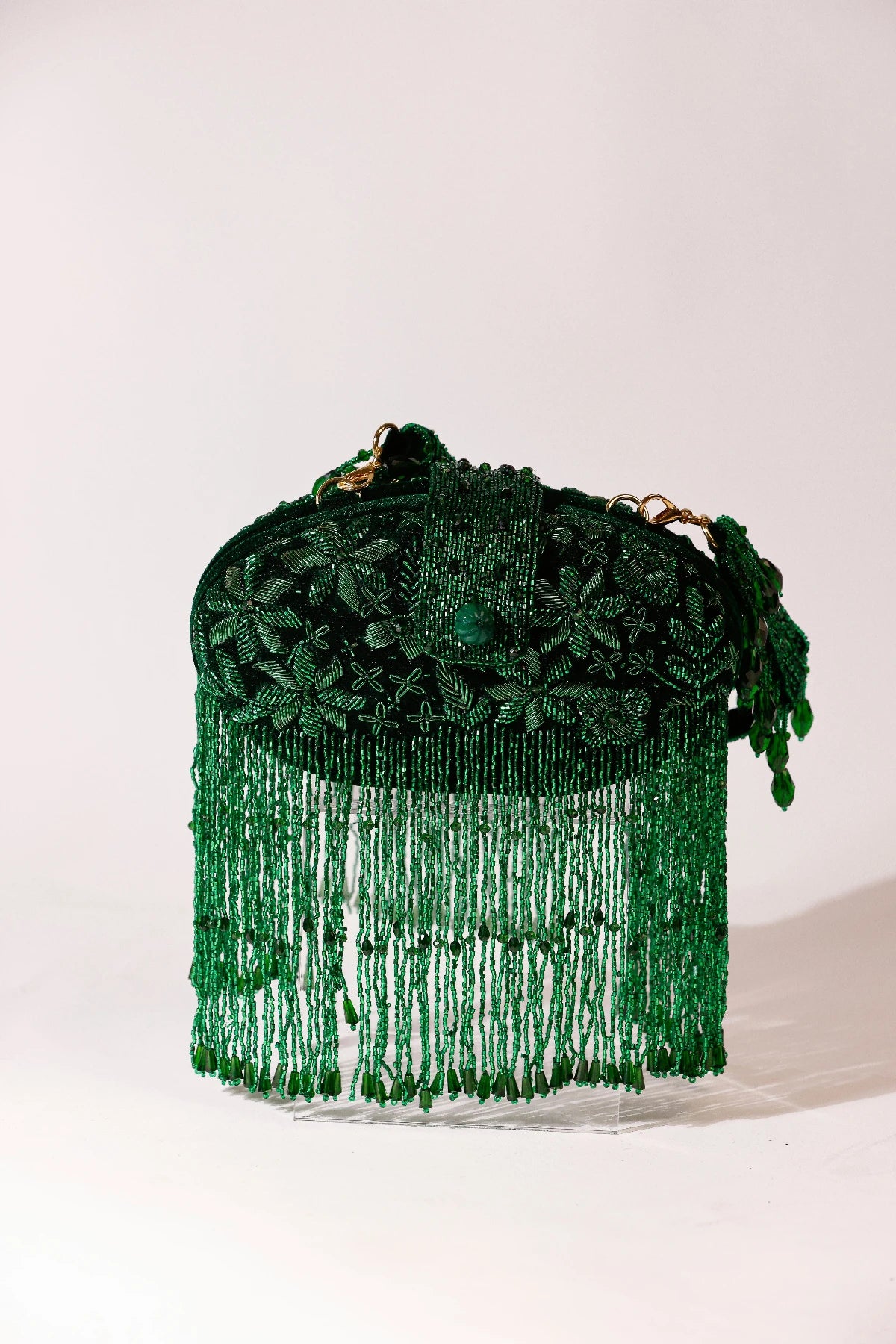 Designer green clutch styled with a lehenga for mehendi functions
