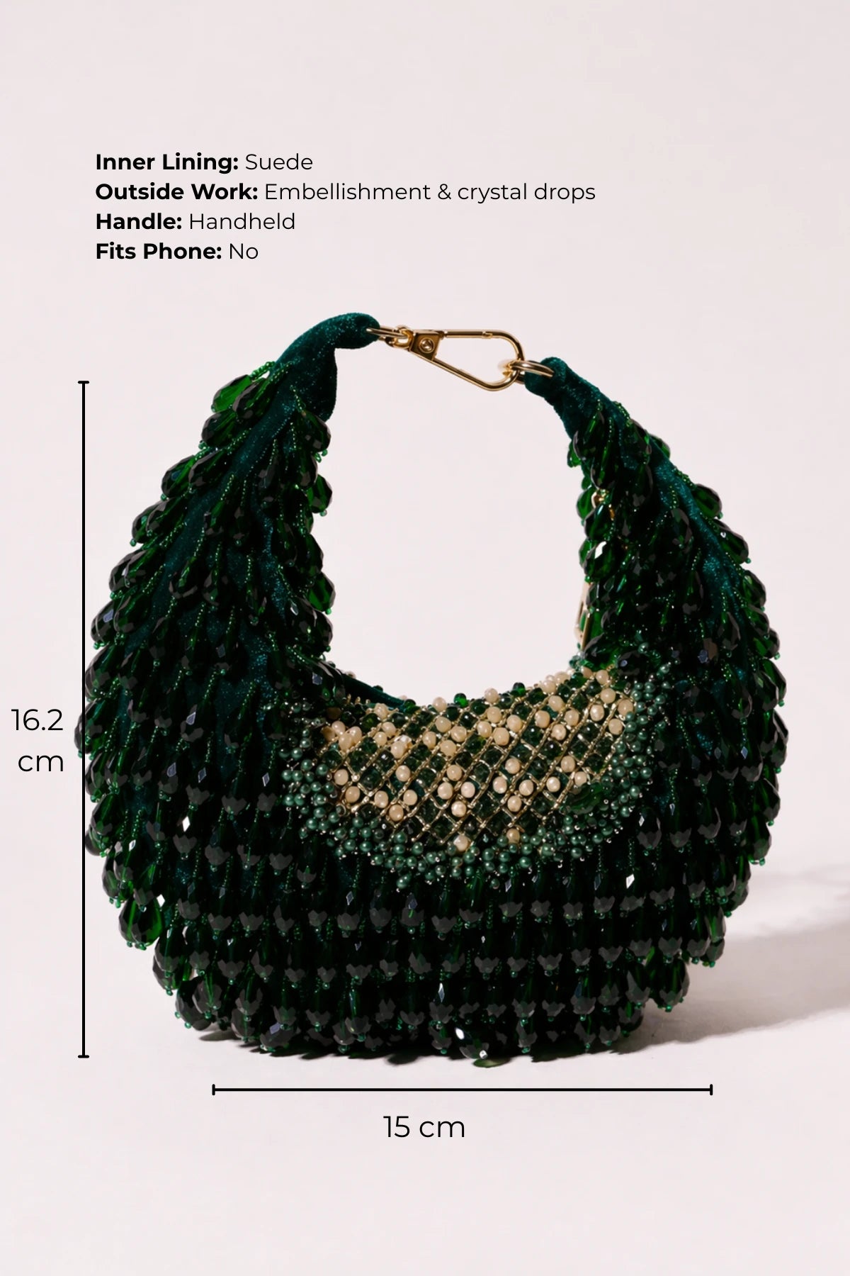 Designer green hobo bag styled with a lehenga for festive occasions