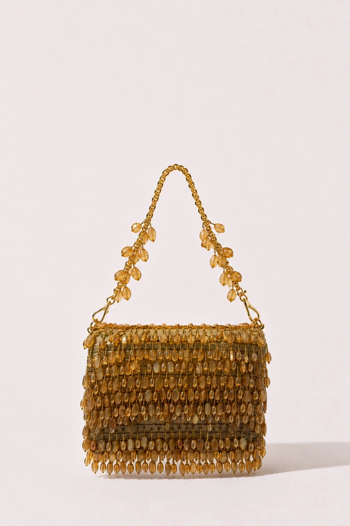 Designer golden Haldi bag styled with a festive lehenga