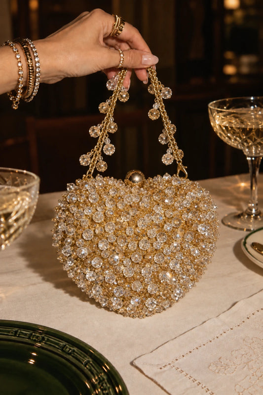 Handcrafted designer heart-shaped handbag with sparkling crystal beads, ideal for sangeet celebrations.