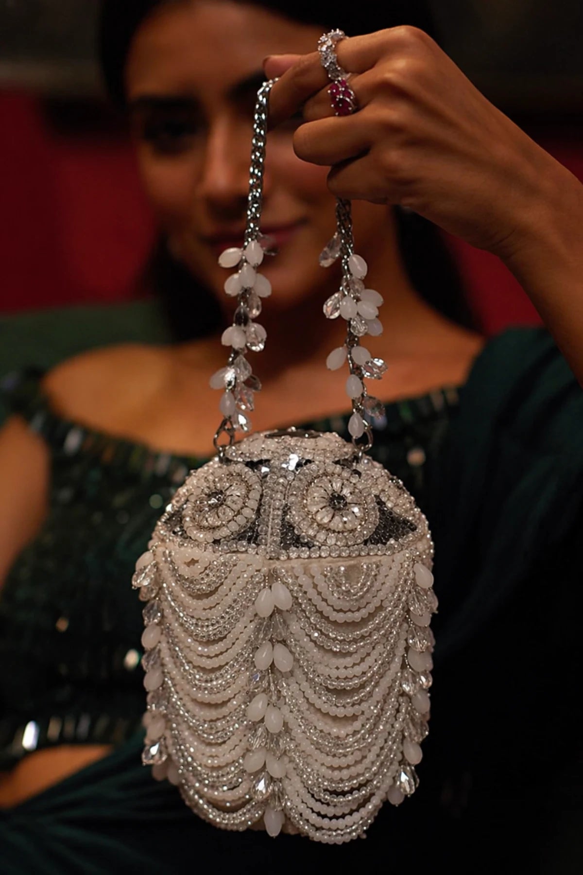 Designer ivory bucket bag styled with a haldi lehenga