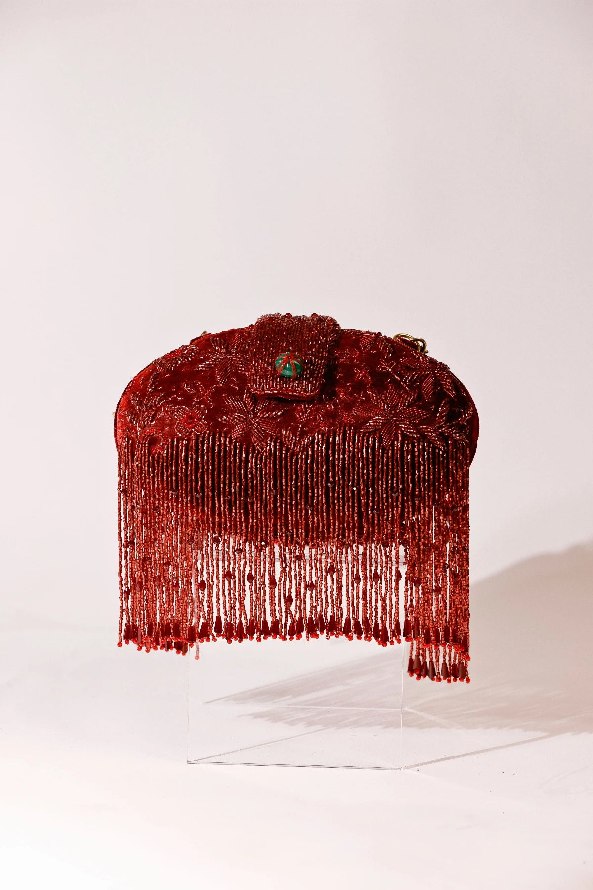 Designer red clutch styled with a lehenga for sangeet functions