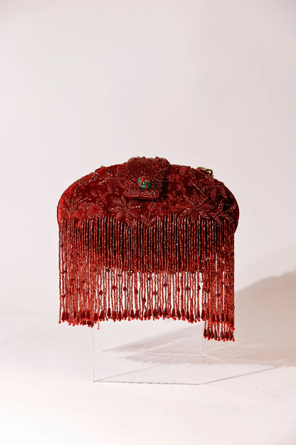 Designer red clutch styled with a lehenga for sangeet functions