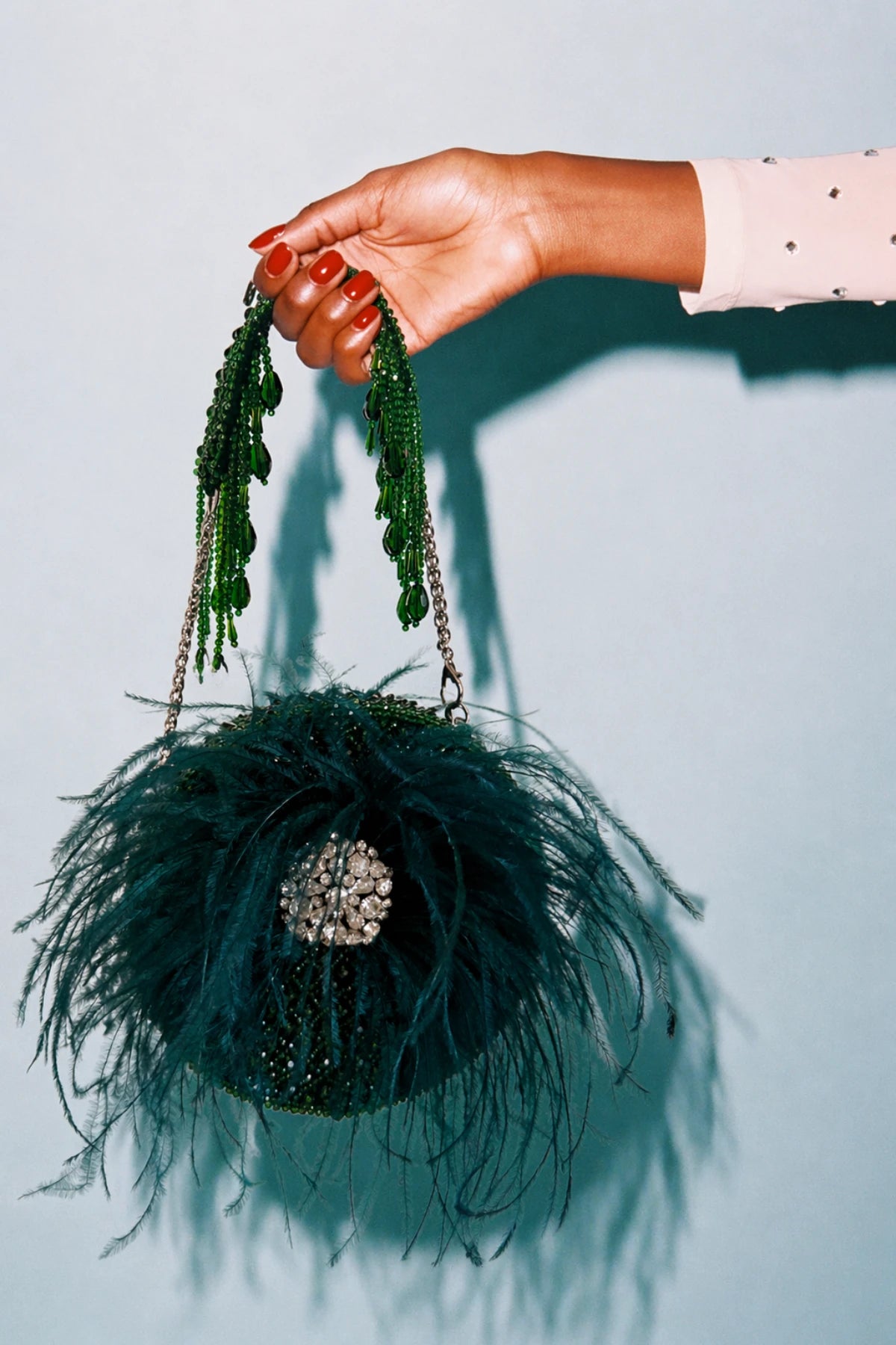 Designer round bag for women with feather detailing