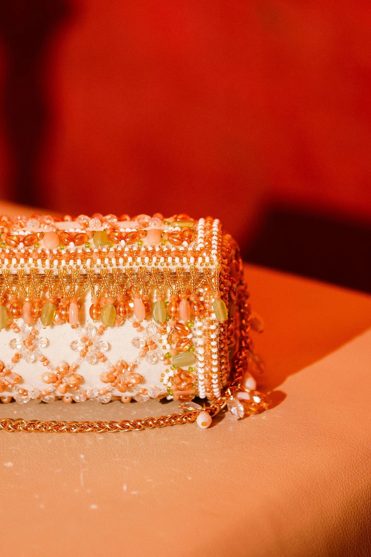 Ethnic cylindrical clutch bag with handcrafted embellishments