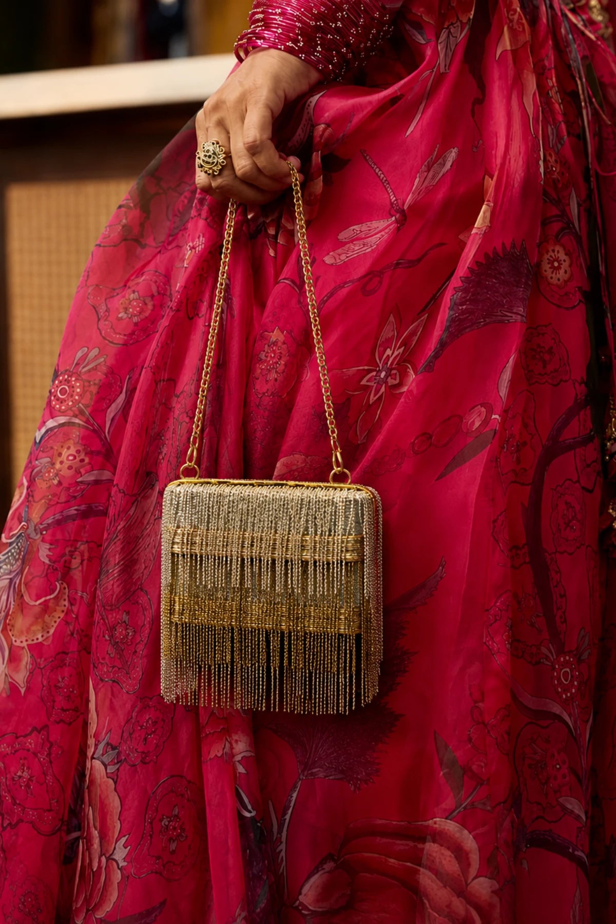 Gold and silver fringe mini bag styled with a festive lehenga