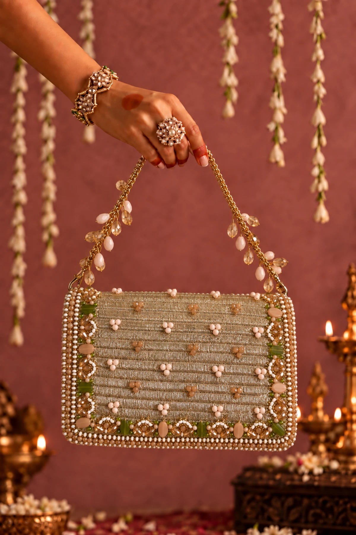 Stylish golden beaded party bag with sparkling stones, sequins and colourful embellishments for festive celebrations.