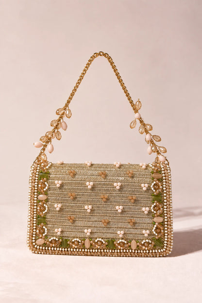 Statement golden wedding handbag featuring floral-inspired beadwork in soft blush, green, white and champagne tones.