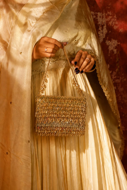 Golden Haldi shoulder bag for women with detailed beadwork