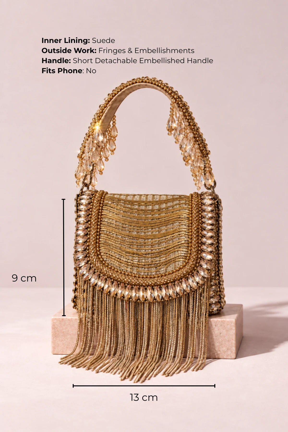 Handcrafted golden mini handbag with crystal and fringe embellishments, ideal as a wedding gift.