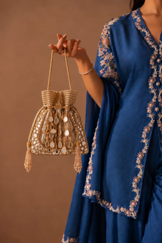Designer golden potli bag with reflective mirror embellishments and delicate handcrafted detailing.