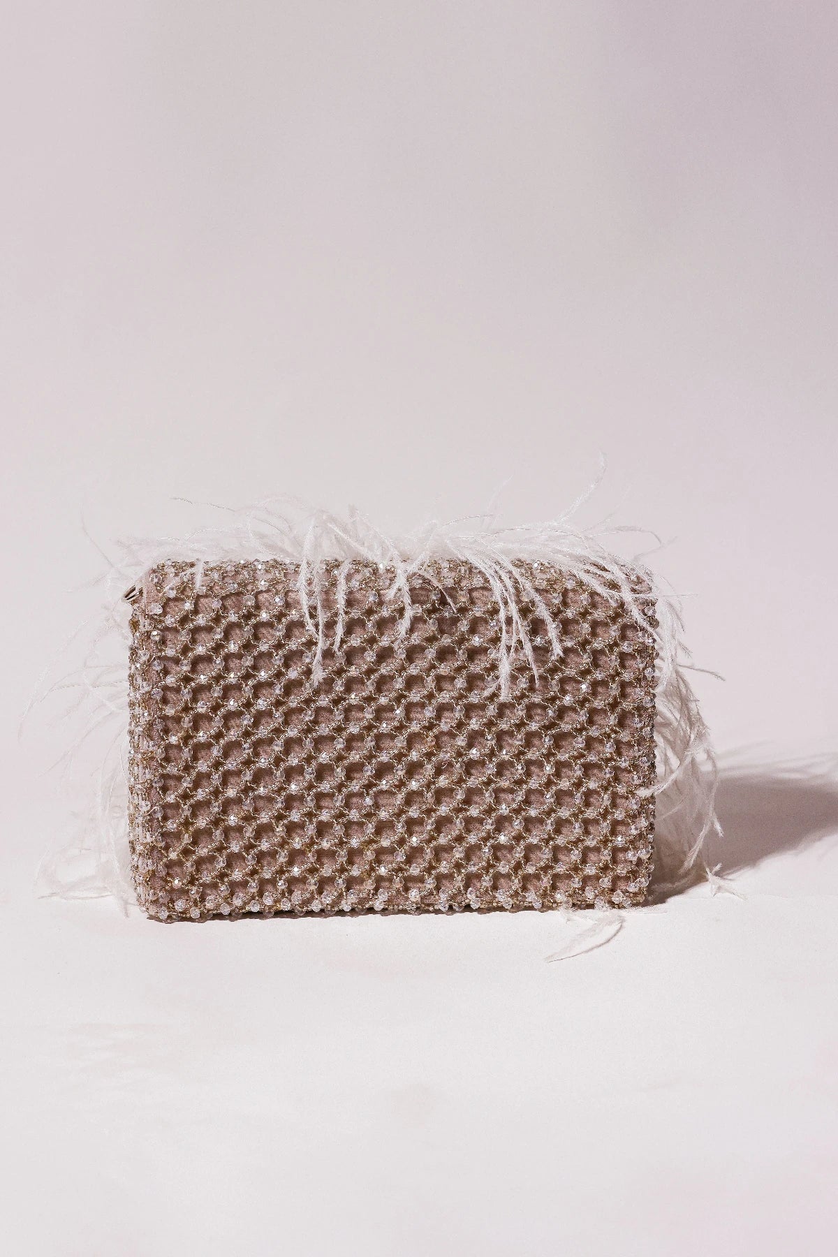 Grey shoulder bag styled with an elegant evening gown