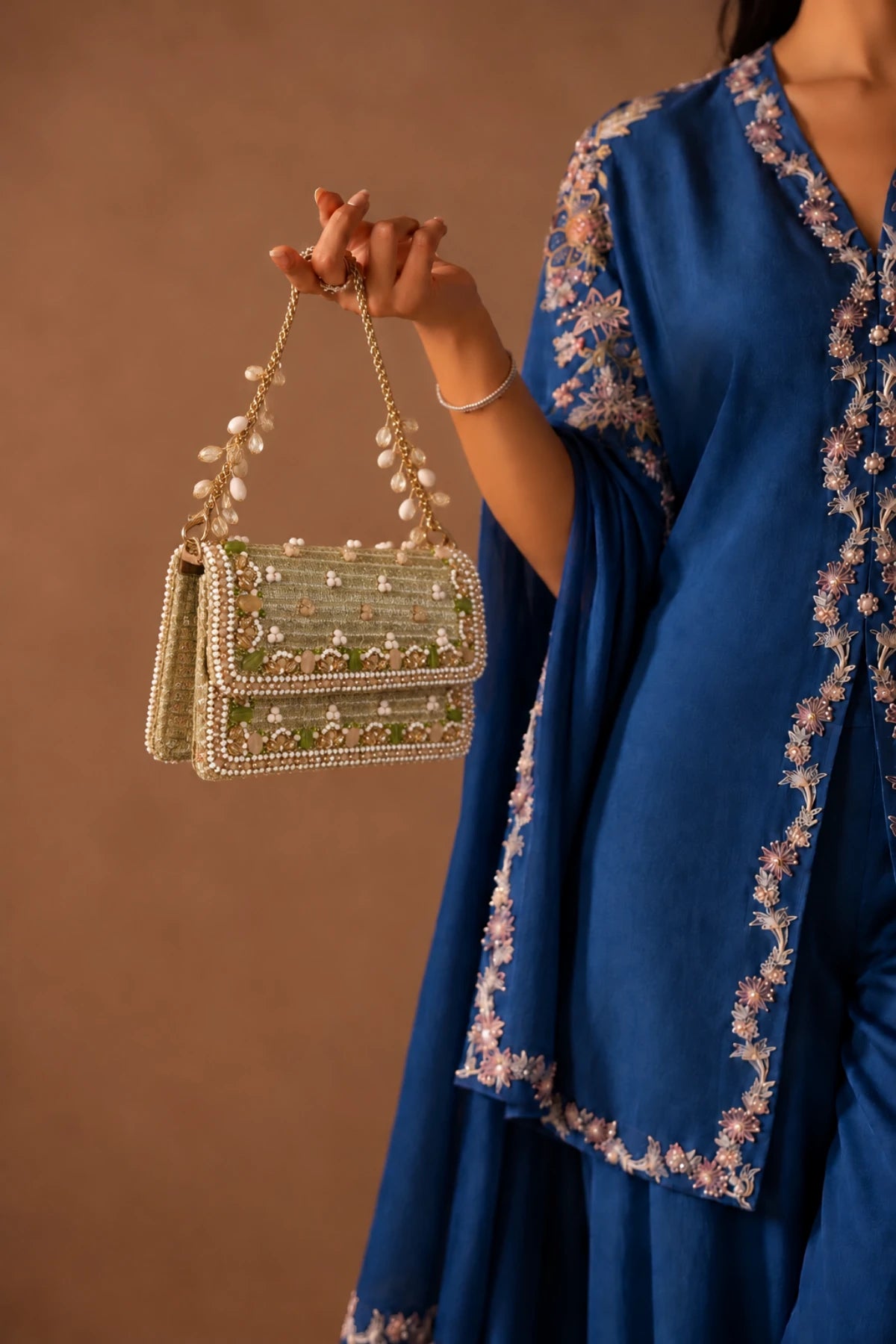 Close-up of Gulshan Golden Bag showcasing intricate floral-inspired beadwork, sparkling stones and delicate sequin embellishments.
