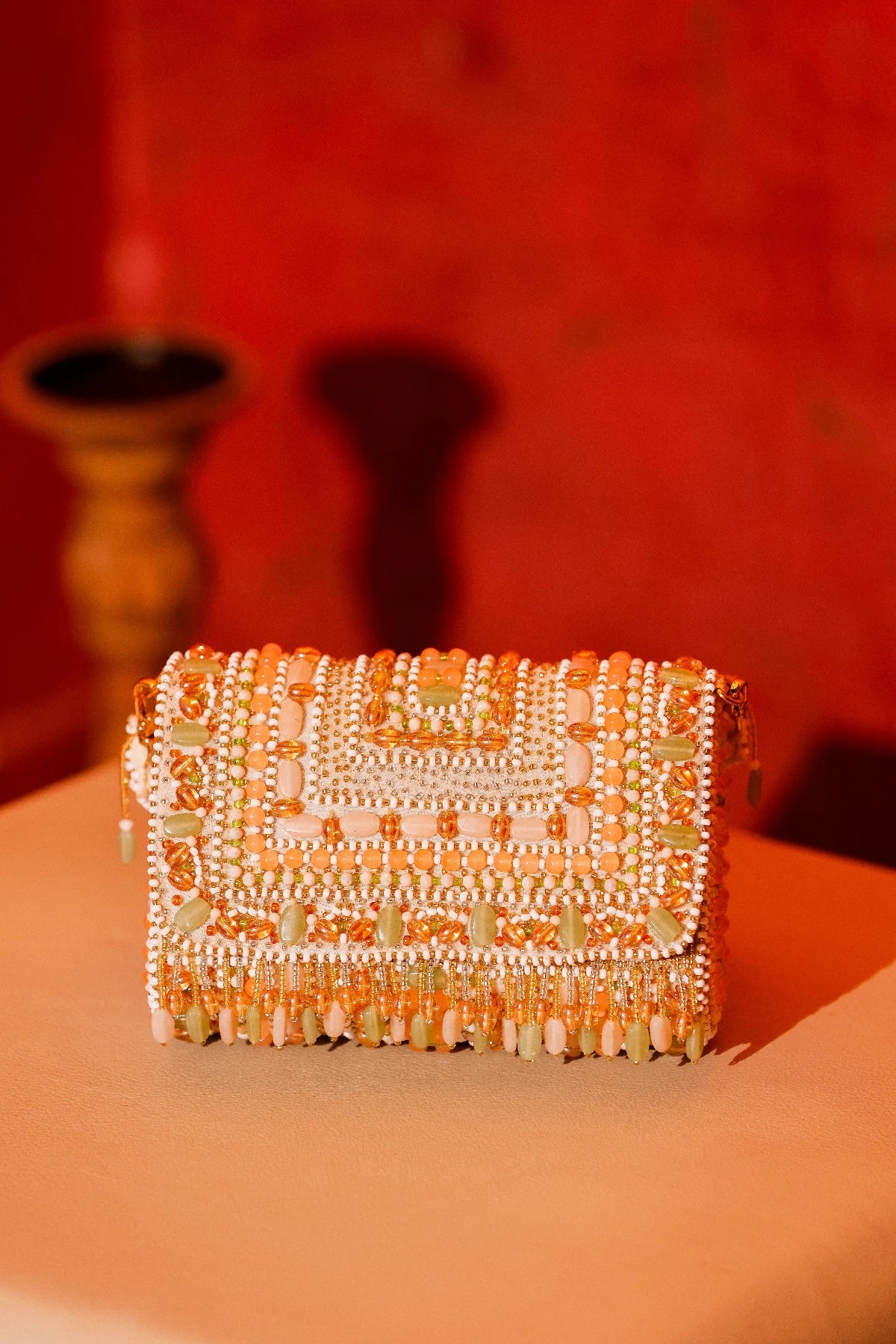 Designer haldi shoulder bag paired with an organza saree