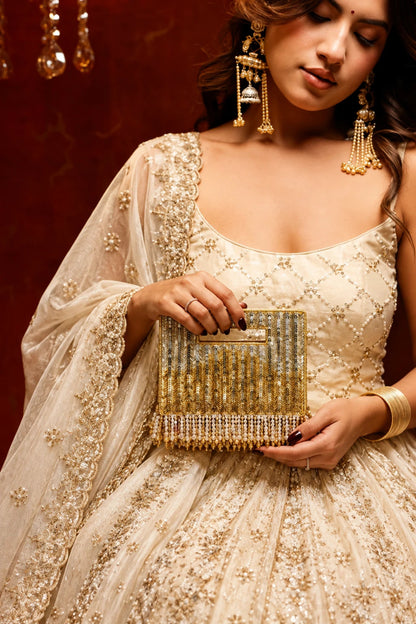 Golden haldi clutch bag with sequin embroidery for festive celebrations
