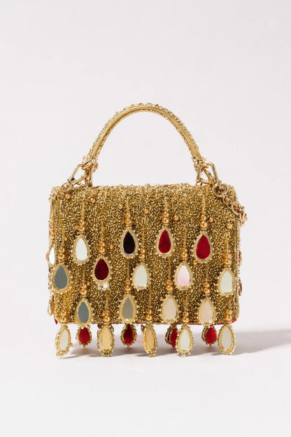 Golden flap bag for haldi celebrations with handcrafted embellishments