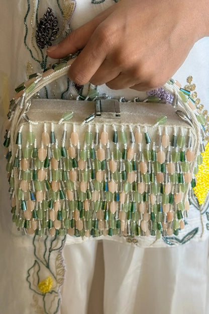 Handcrafted beaded clutch bag with pastel embellishments