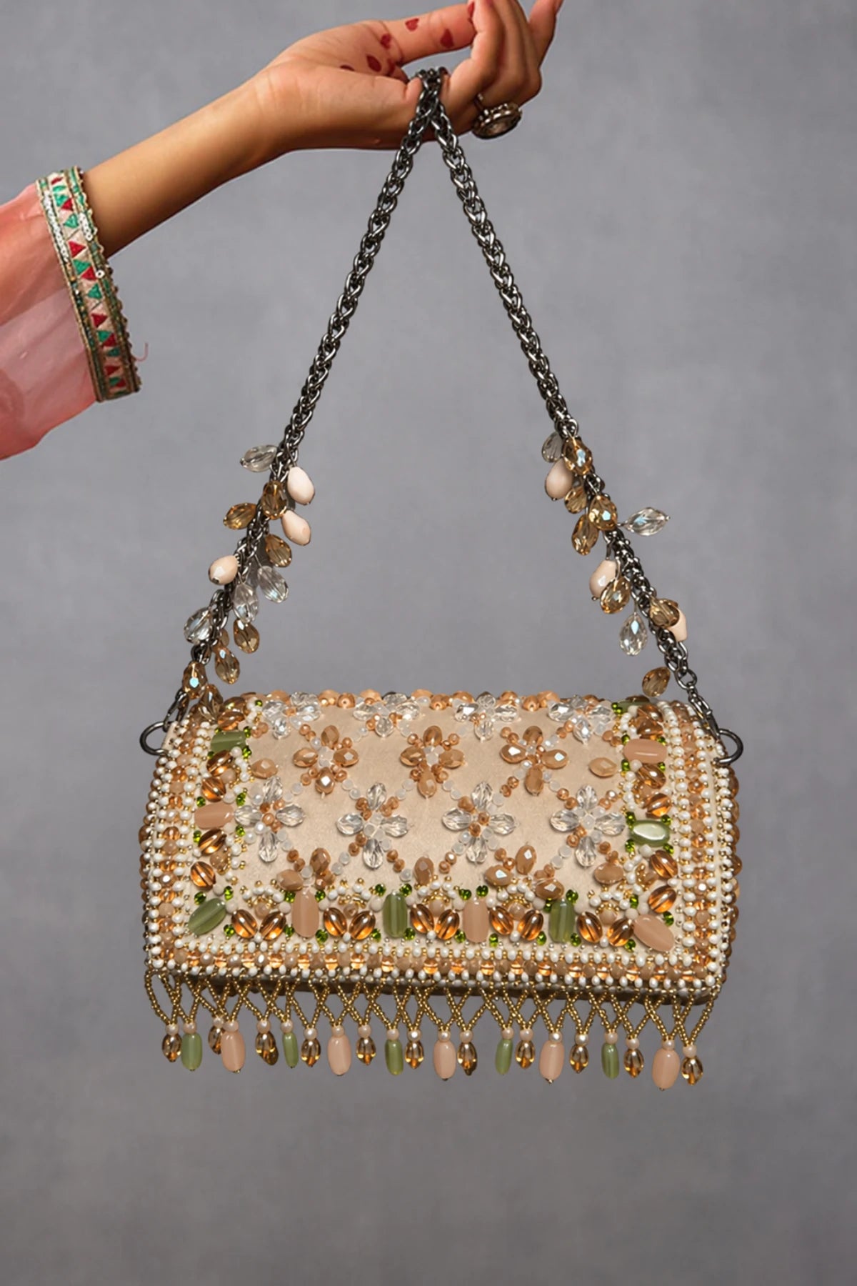Handcrafted beaded clutch bag with elegant fringe detailing