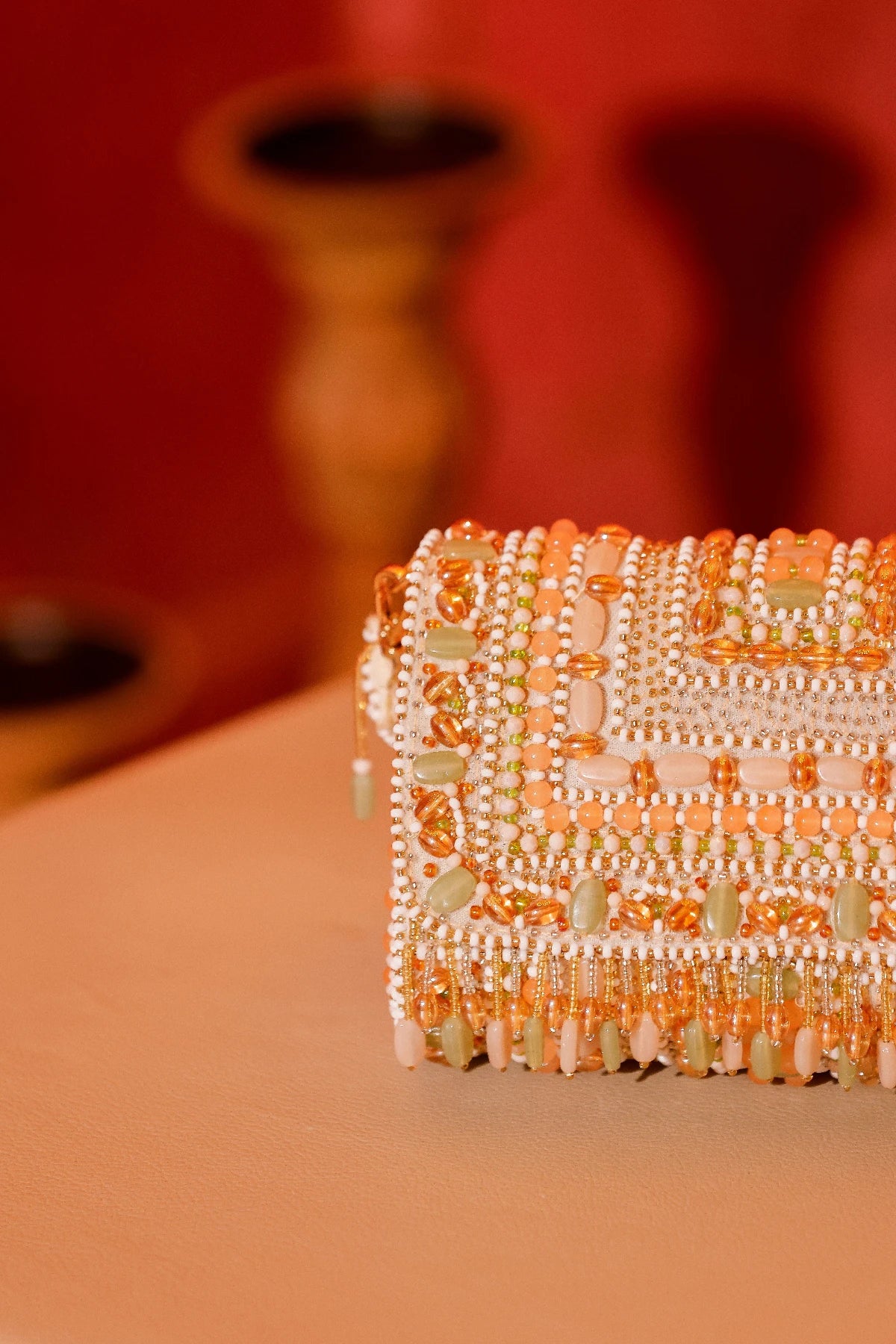 Handcrafted pastel shoulder bag with intricate bead embellishments