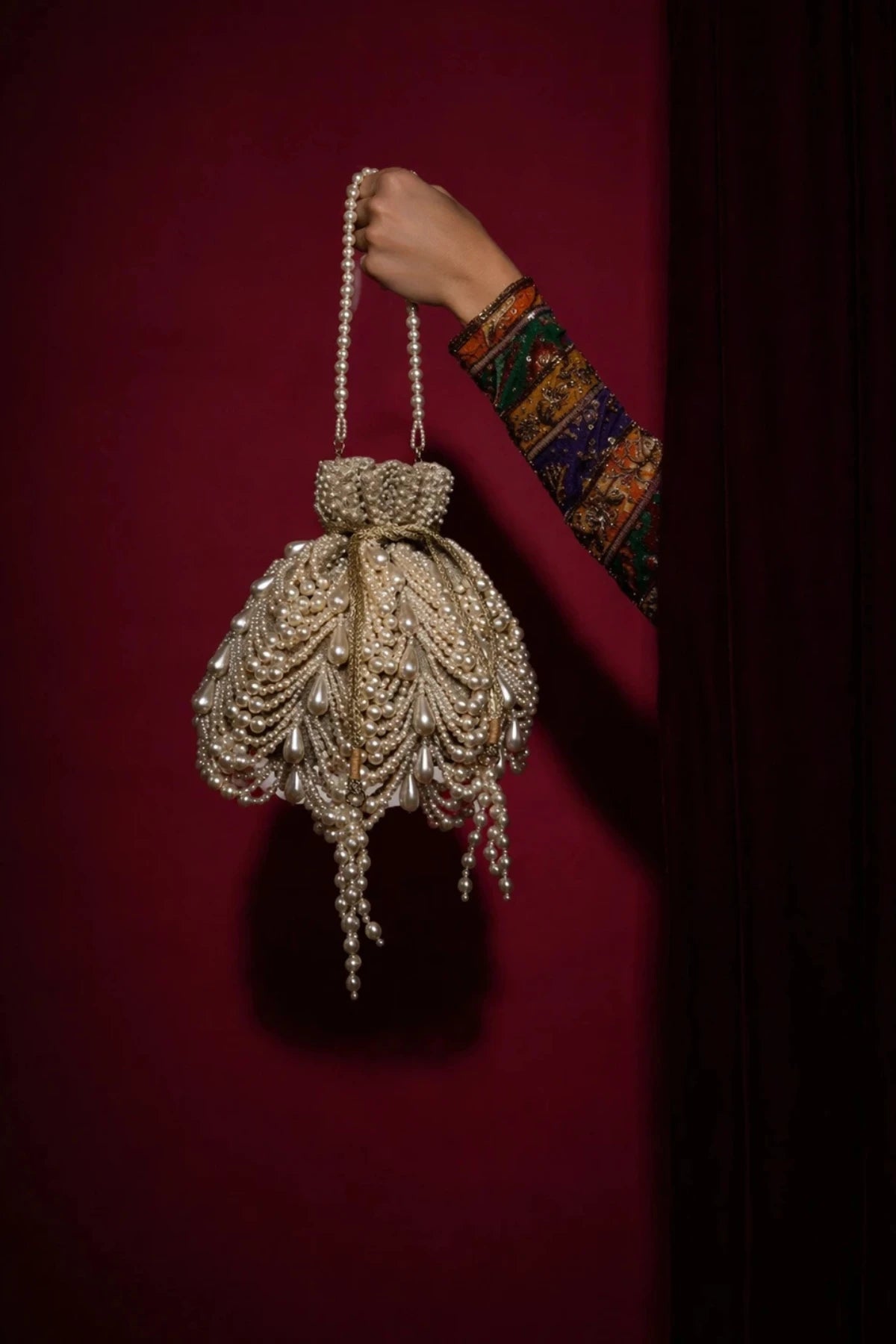 Handcrafted designer potli bag with pearl embroidery