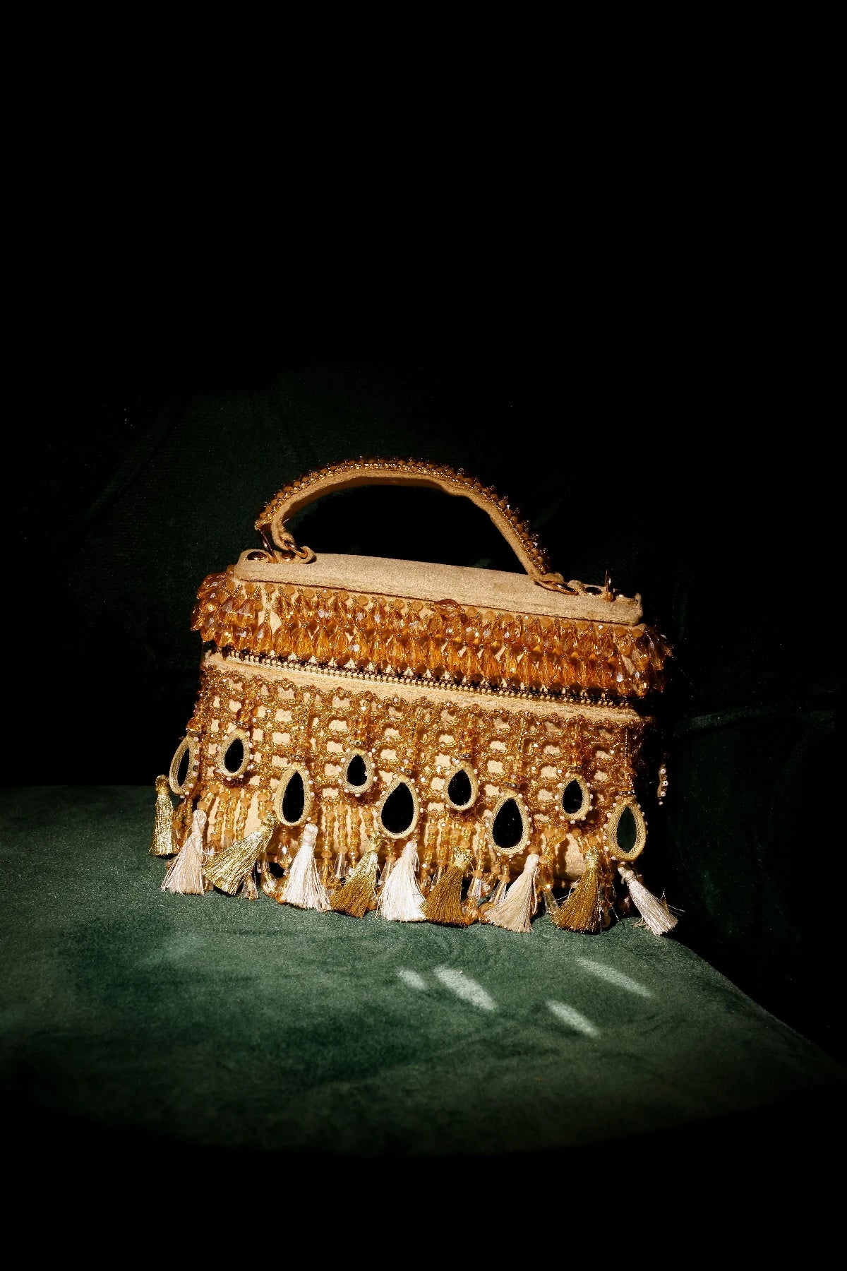 Handcrafted golden ethnic handbag with intricate bead embroidery