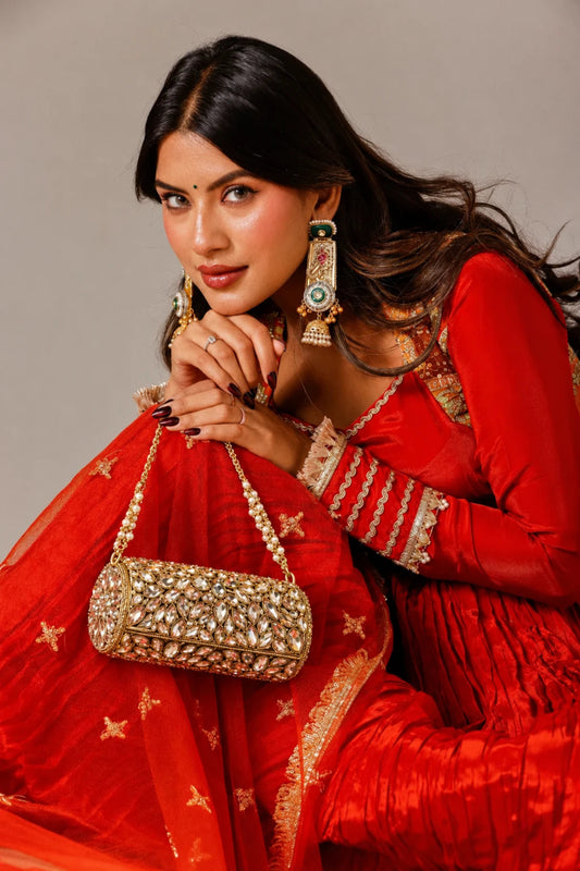 Handcrafted mirror work bag with intricate festive detailing