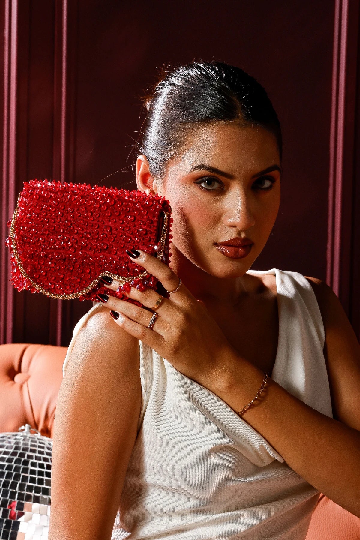 Handcrafted red party handbag with intricate bead embroidery